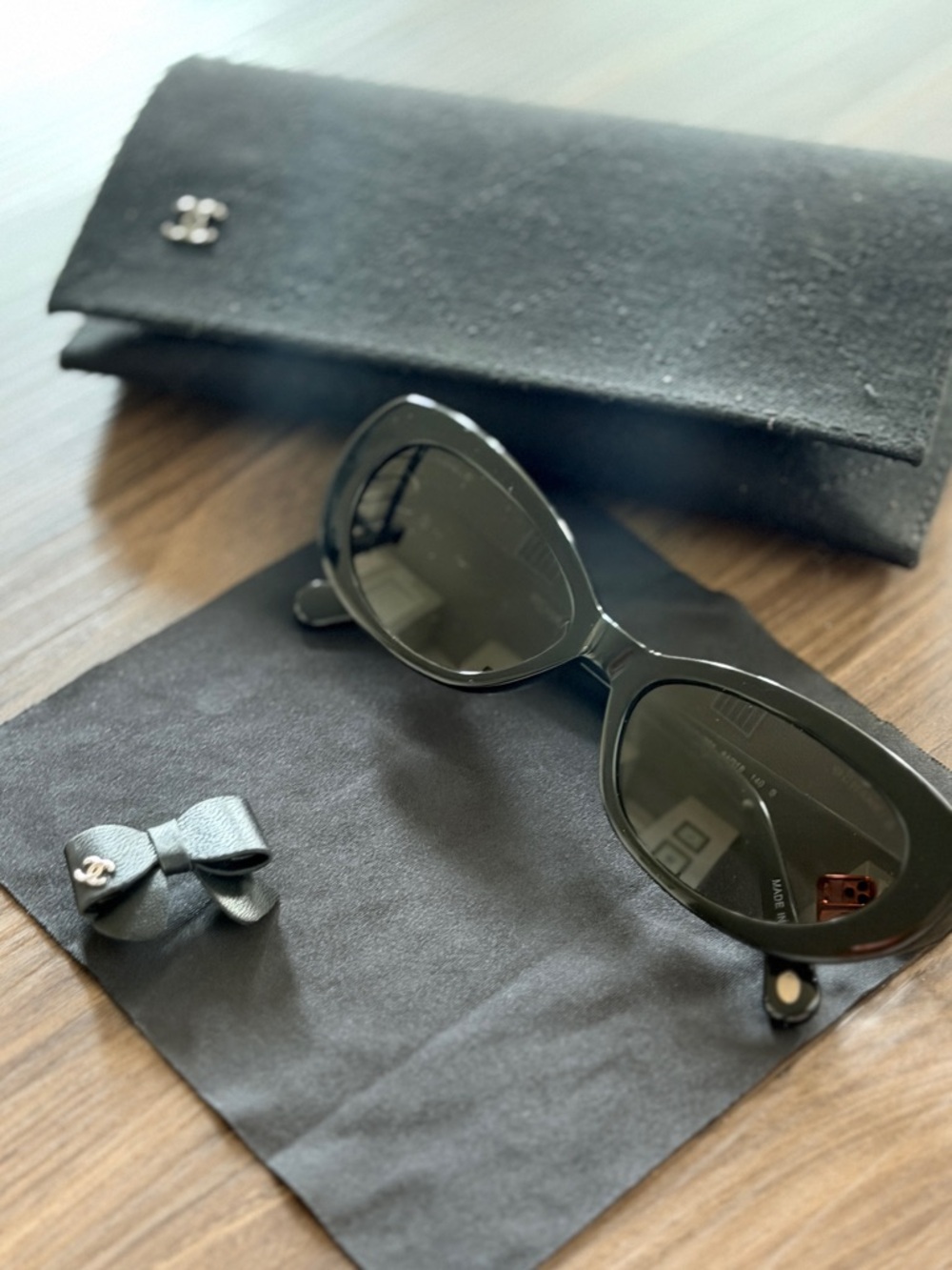 CHANEL Black Oval Sunglasses with Quilted Case and Bow Accent - Picture 2 of 6